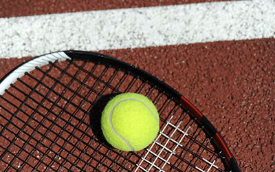 Tennis Ball on Racquets